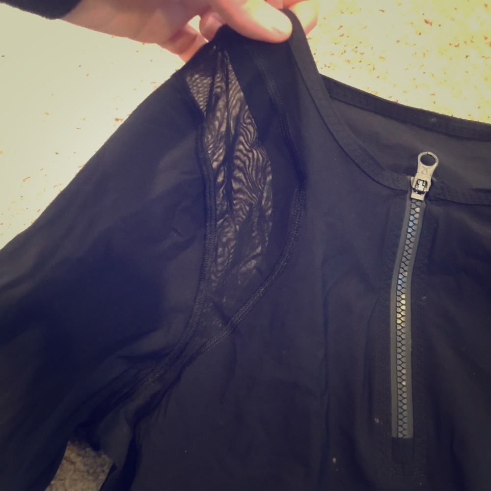 Swim top with mesh paneling
